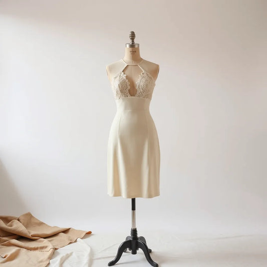 Mannequin wearing a hollow out cutout dress with detailed cutouts on the bodice and waist