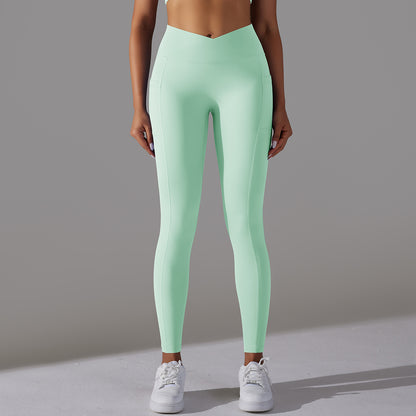 Solid Color Nude Feel Skin Friendly Cross Waist Pocket Yoga Pants High Waist Hip Lift Stretch Fitness Sports Ninth Pants - Iyanka